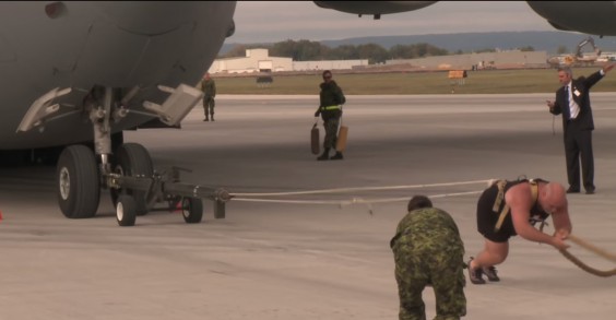 Yes, that man is pulling a cargo plane. Not big deal