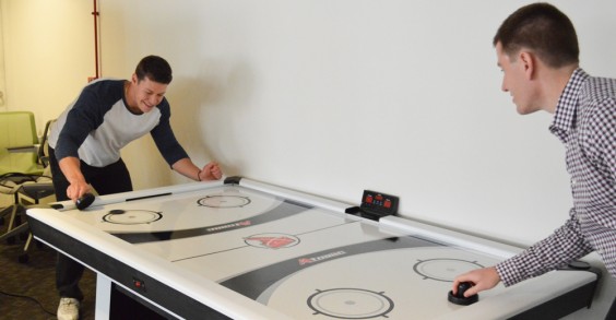 NutraClick Employees Playing Air Hockey